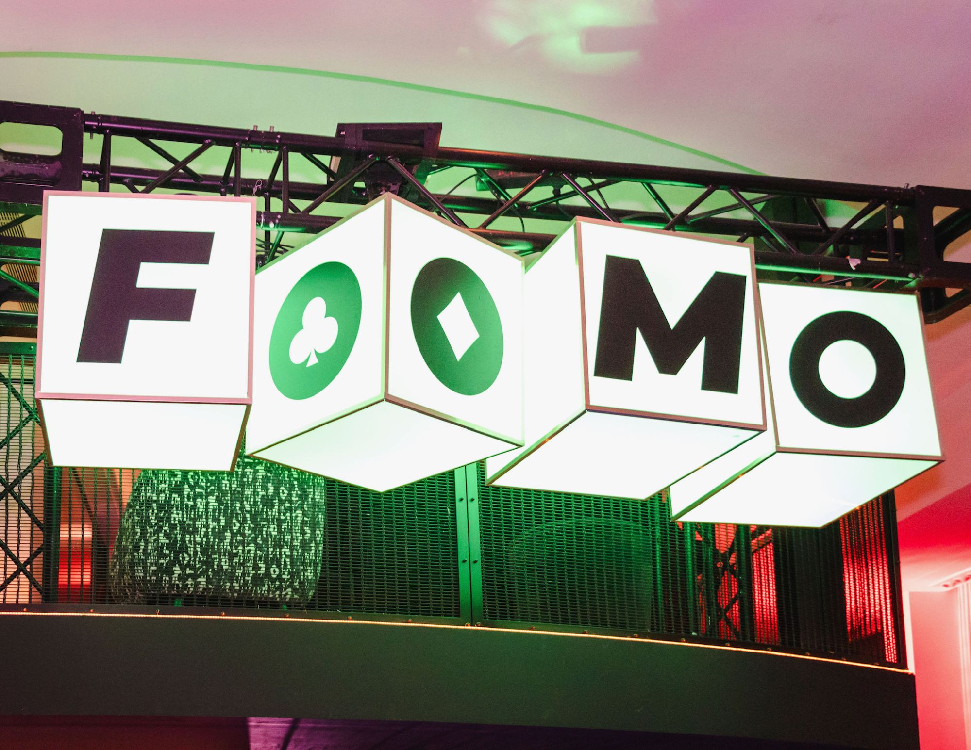 Illuminated brand cubes rigged above the party space