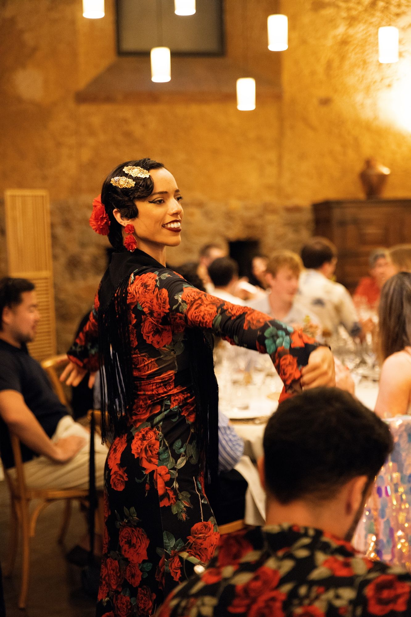 A flamenco dancer performing between the tables at the winery dinner